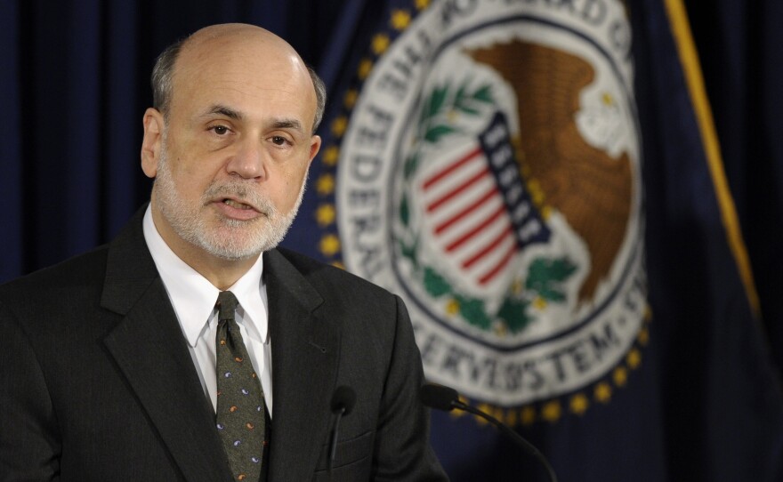 Federal Reserve Chairman Ben Bernanke said Wednesday that a fall in the unemployment rate would not automatically trigger a rise in interest rates. He spoke to the media after the central bank issued a policy update.