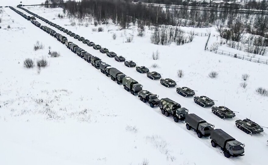 Russian military vehicles are parked waiting to be uploaded on planes at an airfield in Russia on Friday. Over 70 cargo planes are being deployed in Russia's peacekeeping mission in Kazakhstan, according to the Russian Defense Ministry's chief spokesman.