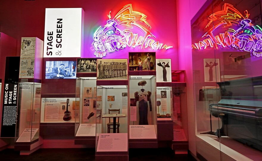 Instruments, costumes and other artifacts fill the 'Taking the Stage' section of the fourth floor Culture Galleries at the NMAAHC.