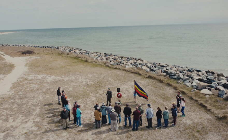 A British Royal Marine holds a memorial service for the fallen soldiers of the War of 1812. In attendance are residents of Tangier Island and descendants of the Black Colonial Marines