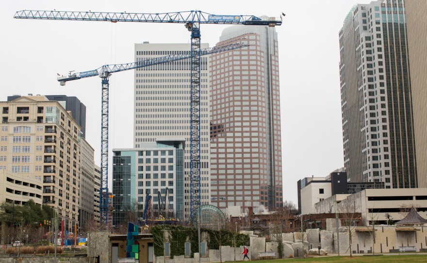 As Charlotte, N.C., experiences a building boom, cranes once again pepper the skyline as a sign of the region's strong economic growth.