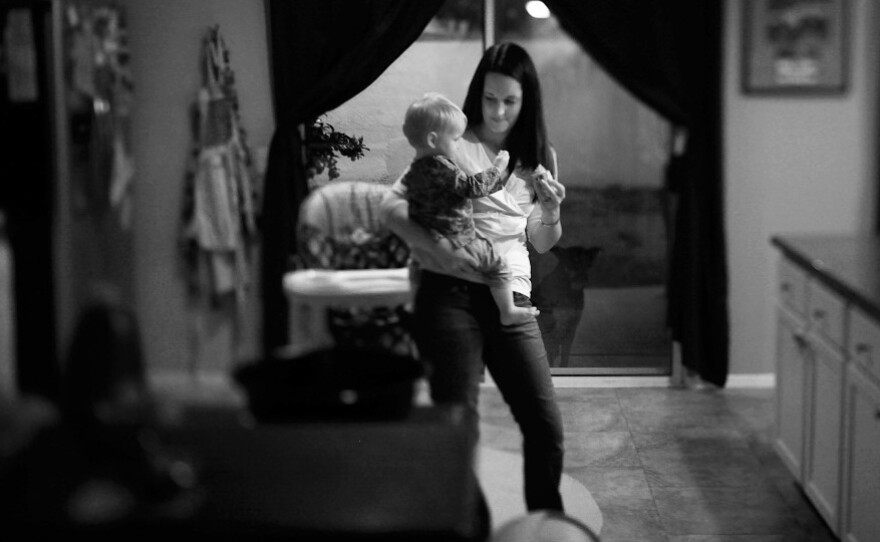 Amy Murray at home with her daughter Harper in Oceanside, Calif. Her husband, Capt. Patrick Murray, with the Darkhorse battalion, returned home from Afghanistan, in April 2011; 25 Marines from his unit did not.