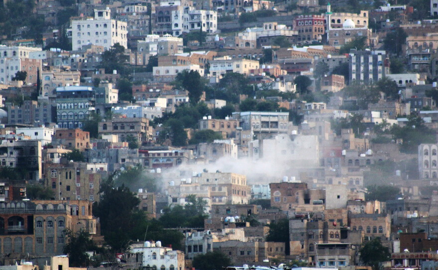 FILE - Smoke rises after an attack by Houthi rebels on the city of Taiz, Yemen, on Oct. 21, 2015. (AP Photo/Abdulnasser Alseddik, File)