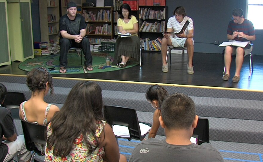 Kids write operas and then work with professional singers during a rehearsal. Here students provide feedback to actors at Barrio Logan College Institute.