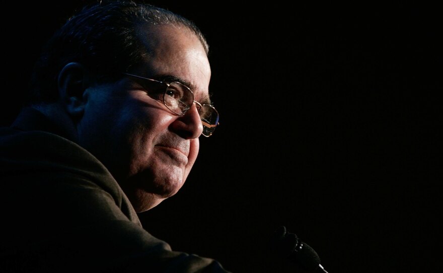 U.S. Supreme Court Associate Justice Antonin Scalia pauses as he addresses a Northern Virginia Technology Council breakfast in December 2006 in McLean, Va.