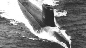 Researcher Sydney Levitus uses cards from sea craft like the USS Triton to glean information about global warming.