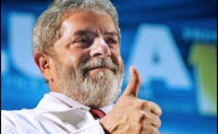 Brazilian President Luiz Inacio Lula da Silva, pictured here saluting supporters and a rally, faces a re-election challenge in October.