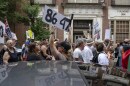 A demonstrator holds up an "8647" sign at a "No Kings" protest in Louisville, Ky., in June 2025. It's an anti-Trump slogan, with multiple interpretations.
