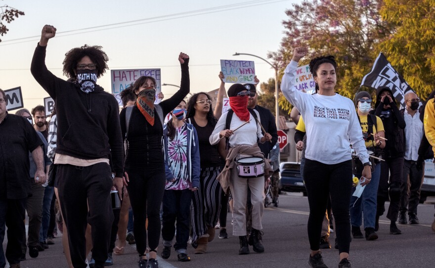 Protesters march down Vine Street in Lakeside expressing their anger over the stabbing of a teenage black girl by a 16-year-old white boy in an apparent hate crime, April 23, 2022.