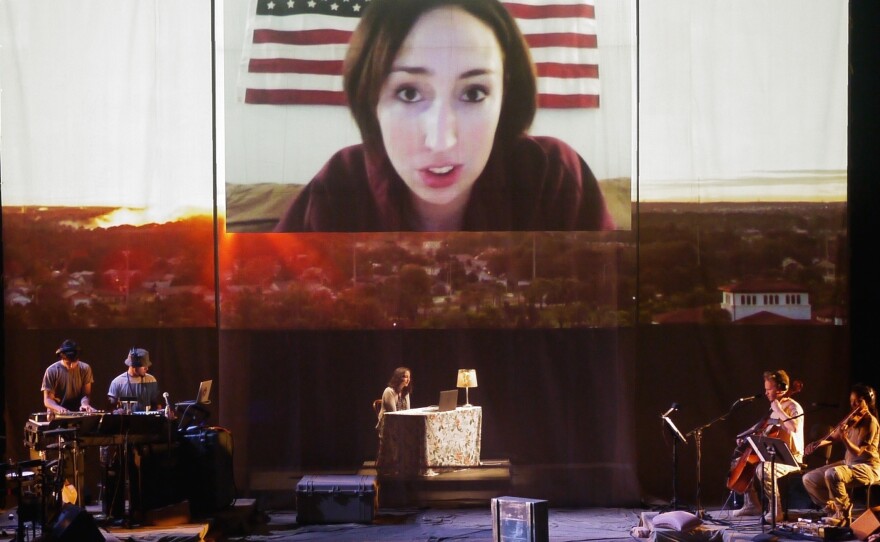 In the performance, an actress playing the wife of a Marine talks to her husband via Skype.