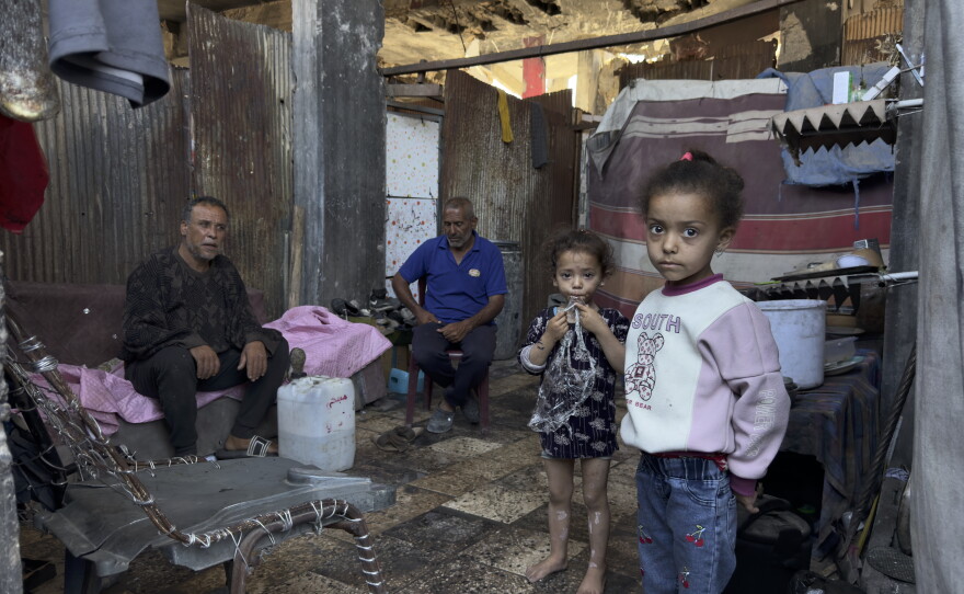 Subhi Shurabasi, a 60-year-old grandfather, shelters with his sons, their wives and his grandchildren inside the ruins of their destroyed home in al-Shujaiya, on May 31.