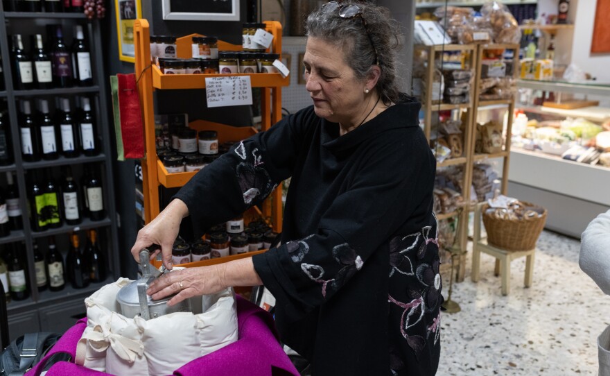 Gloria Lucchesi shows a cooking container, on Nov. 12, in San Casciano dei Bagni.