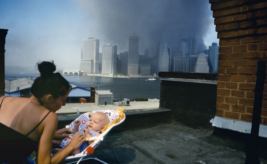 A Brooklyn Heights rooftop affords a terrifying view of Lower Manhattan enveloped in smoke.