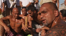Hale Gualderama (far right) and other Native Hawaiian members engaging in cultural practice.