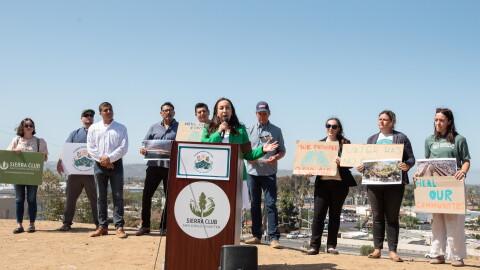 Environmental advocates and elected officials, including San Diego County Supervisor Paloma Aguirre (center), say that a trade deal with Mexico must include solutions to the Tijuana River sewage crisis at a press conference in Otay Mesa West on July 16, 2026. 