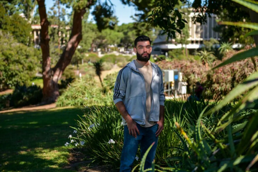 Luis Soto, 22, who is a fifth year urban studies major at UC Irvine, in Aldrich Park on Oct. 25, 2022.