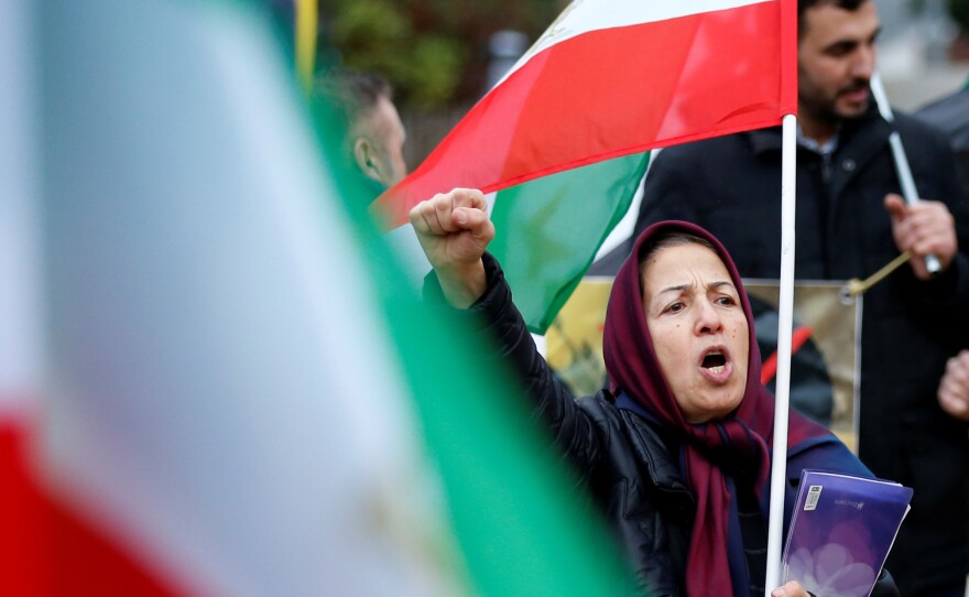 A protester chants slogans against the Iranian government outside the European Union Council in Brussels, Belgium on Wednesday.