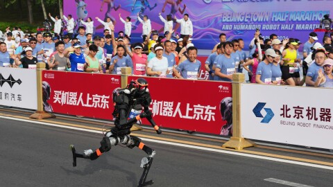 A robot starts off for the Beijing E-Town Half Marathon and Humanoid Half Marathon on the outskirts of Beijing on Sunday, April 19, 2026.