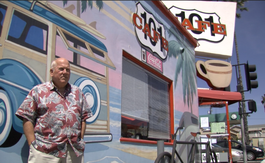 John Daley is the original owner of the 101 Cafe on Coast Highway in Oceanside. The murals painted on the wall of the cafe have changed several times over the years, but visitors still take photographs next to the woodie station wagons, March 28, 2017.