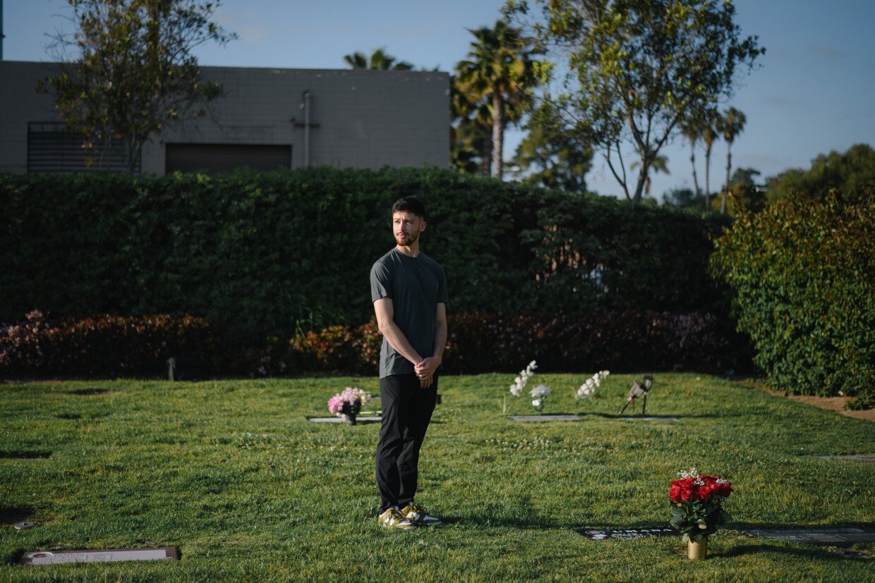 Roberto Umana stands for a portrait at the cemetery where his brother, Brian, is buried in San Diego, California on April 23, 2025. After a three year-legal battle, Roberto and his family’s attorneys won a $1 million settlement from National City for the 2021 police killing of his brother.