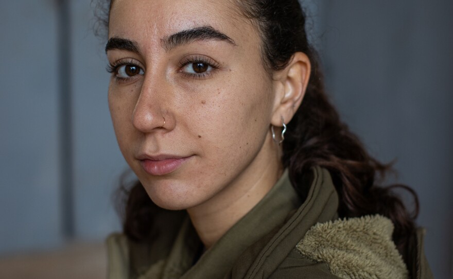Zohar Ben Shushan, an Israeli military reservist and paramedic, sits for a portrait at a military base near the border with Lebanon in northern Israel on Nov. 28.