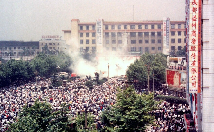 Police initially used tear gas and stun grenades against protesters to try to disperse the crowds thronging Chengdu's main square on June 4.
