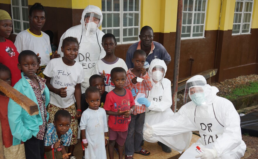 Dr. Risi (top, center) spent a month working with the medical team at Kenema General Hospital, the largest Ebola treatment center in Sierra Leone.