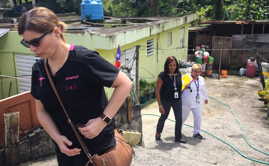 Dr. Carla Rossotti (left), a general practitioner, and her health care team leave the home of the their patient, 37-year-old Osvaldo Daniel Martinez. He has the symptoms of a degenerative disease, Rossotti says, but he needs a neurologist's evaluation before he can get proper treatment.