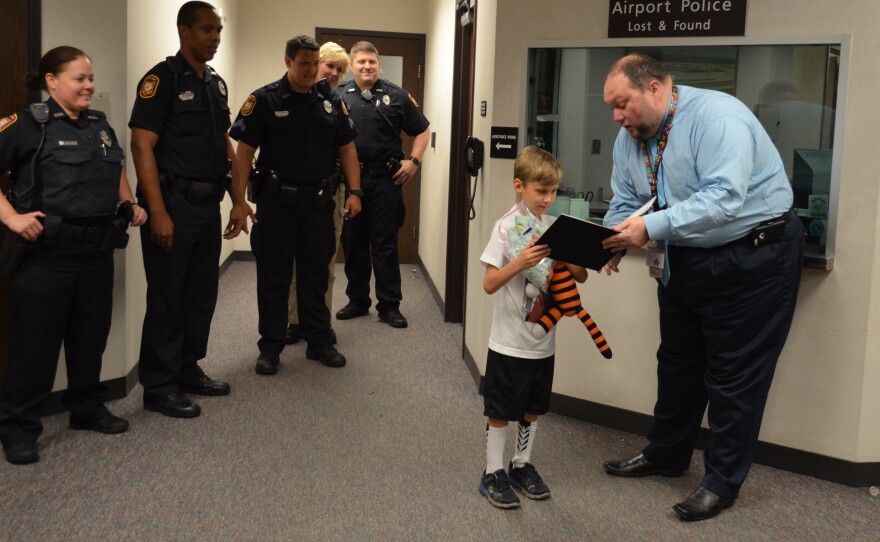 Owen, 6, is reunited with his tiger, Hobbes, after leaving the stuffed animal at the airport.