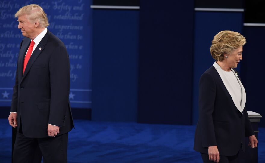 Donald Trump and Hillary Clinton arrive for the second presidential debate at Washington University in St. Louis, Mo., on Oct. 9. A new report says brand loyalty among the two major presidential candidates is sorely lacking.