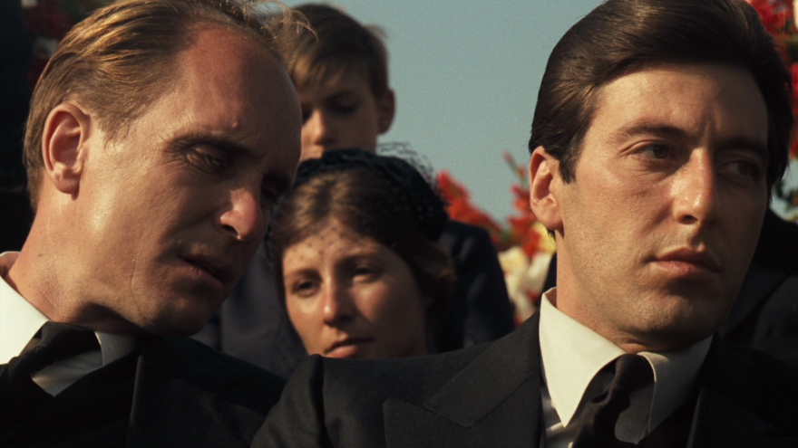 Robert Duvall as Tom Hagen and Al Pacino as Michael Corleone at Don Vito's funeral in "The Godfather" (1972).