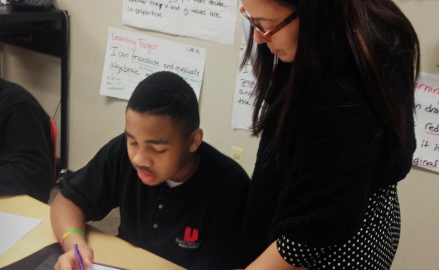 Teacher Jennifer Bahns helps her seventh graders work through algebraic equations that, before the Common Core, were taught in eighth or ninth grade.
