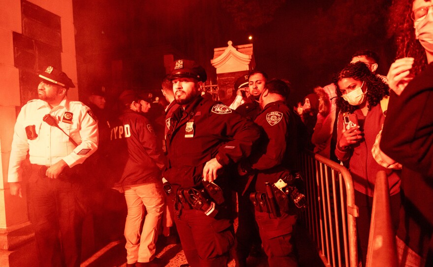 Pro-Palestinian supporters confront police during demonstrations at The City College Of New York as the NYPD cracks down on protest camps at both Columbia University and CCNY on Tuesday in New York City.