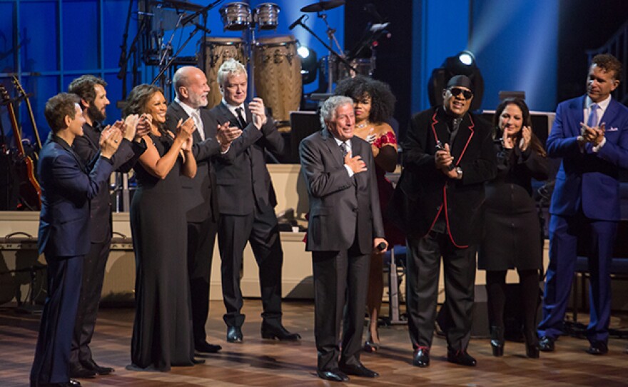 The performing artist joins Tony Bennett on-stage during the finale (l-r): Michael Feinstein, Josh Groban, Vanessa Williams, Bruce Willis, Chris Botti, Tony Bennett, Wé McDonald, Stevie Wonder, Gloria Estefan and Brian Stokes Mitchell.