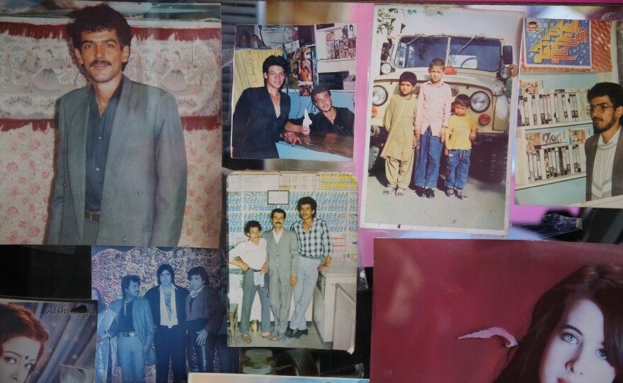 Unclaimed photographs decorate a small photo studio in the west of the capital.