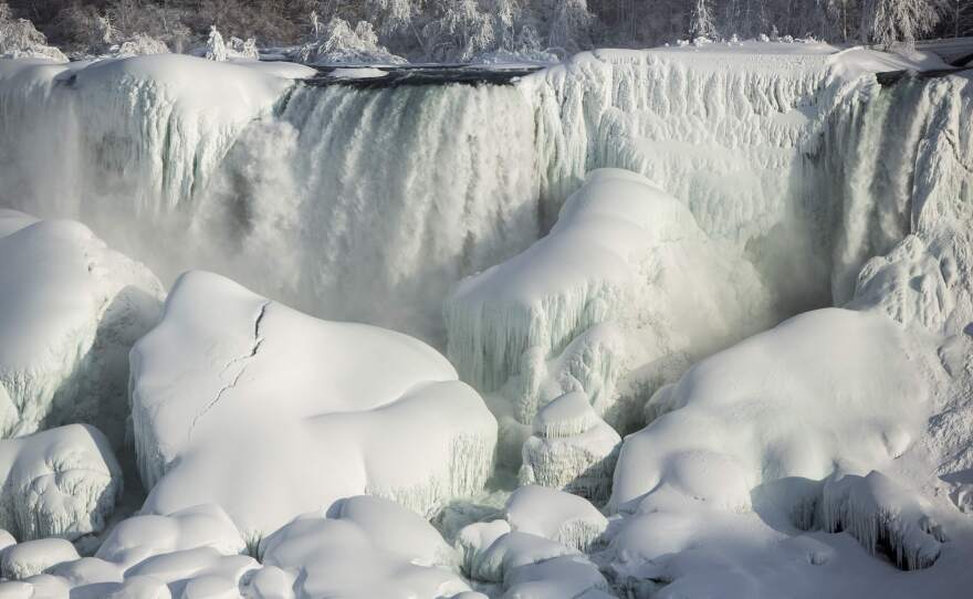 A partially frozen American Falls in sub-freezing temperatures is seen in Niagara Falls, Ontario, on Tuesday. Temperature dropped to 6 degrees Fahrenheit on Tuesday. The National Weather Service has issued a wind chill warning for western New York from midnight Wednesday to Friday.