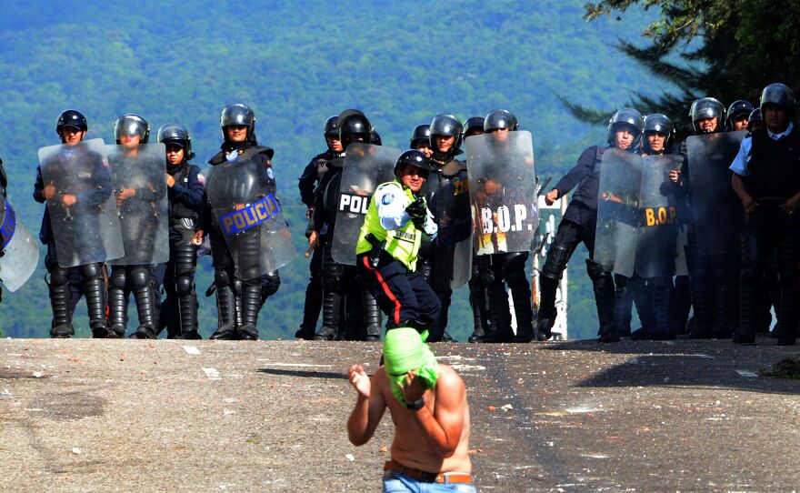 Riot police confront students opposed to President Nicolas Maduro's government in San Cristobal, Venezuela, on Monday. Pope Francis met with Maduro on Monday night to discuss the crisis in Venezuela.
