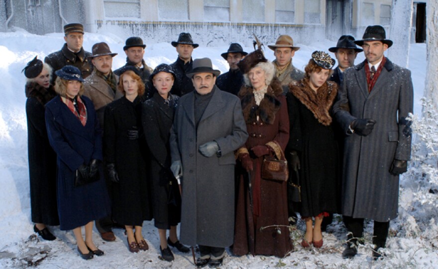 Star David Suchet (center) is joined by a first-class rail car full of great actors. Poirot solves the greatest case of his career aboard the world’s most glamorous train, the Orient Express.