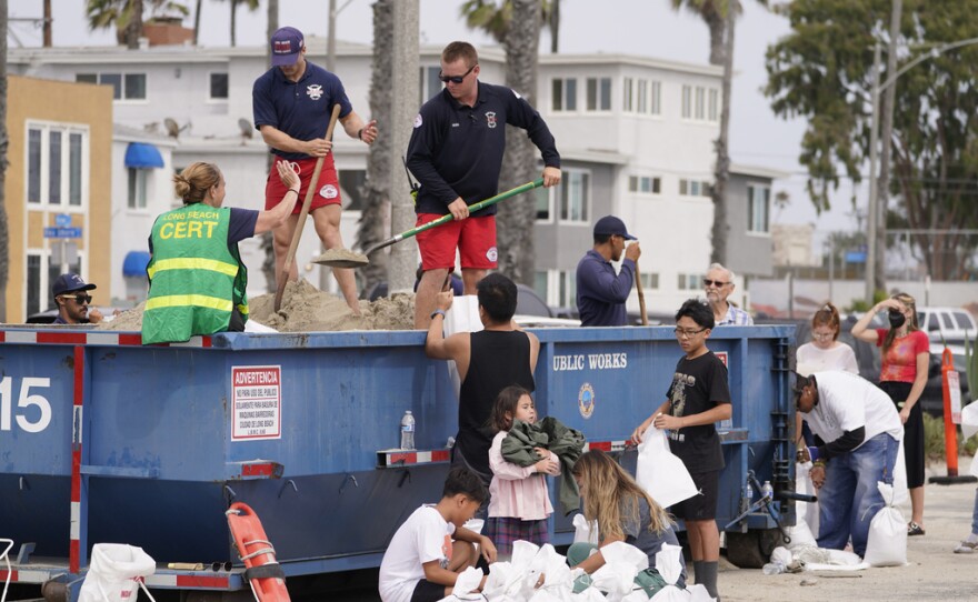 Long Beach Lifeguards fill up sandbags for residents ahead of Hurricane Hilary in Long Beach, Calif., Saturday, Aug. 19, 2023. Hurricane Hilary roared toward Mexico’s Baja California peninsula late Saturday as a downgraded but still dangerous Category 2 hurricane that's likely to bring “catastrophic” flooding to the region and cross into the southwest U.S. as a tropical storm.