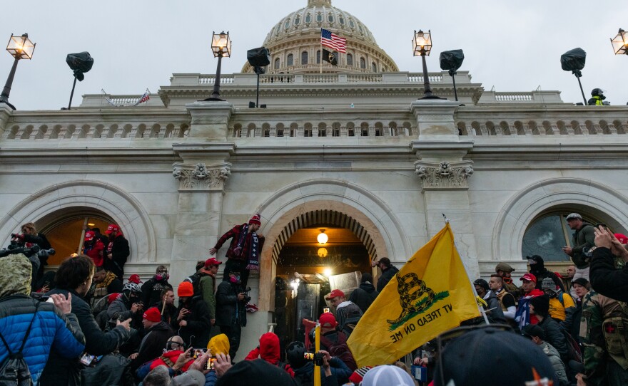 Rioters clash with law enforcement as they attempt to enter the U.S. Capitol building on Jan. 6.