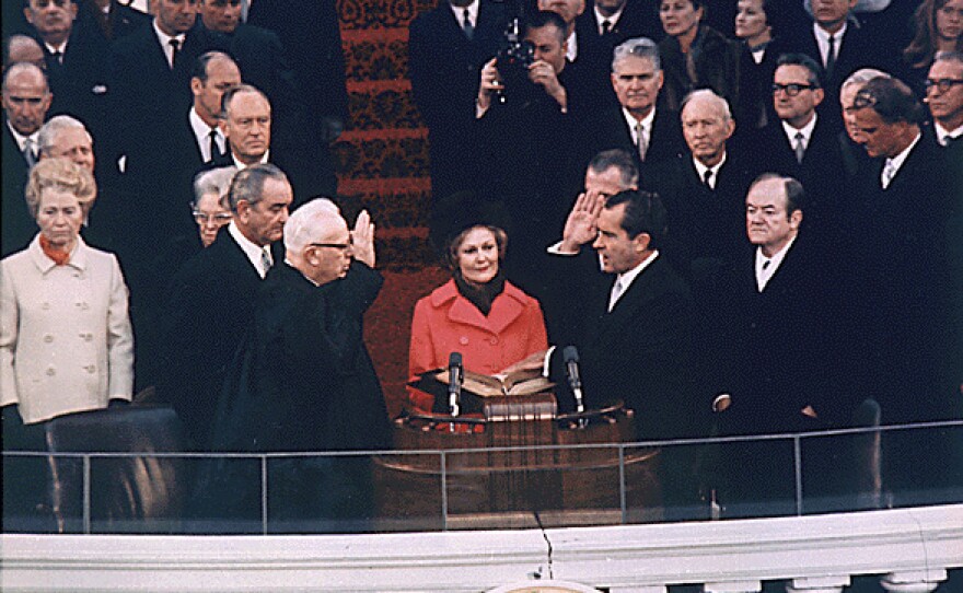 Nixon is sworn in as the 37th President by Chief Justice Earl Warren on Jan. 20, 1969, with the new First Lady, Pat, holding the family Bibles.