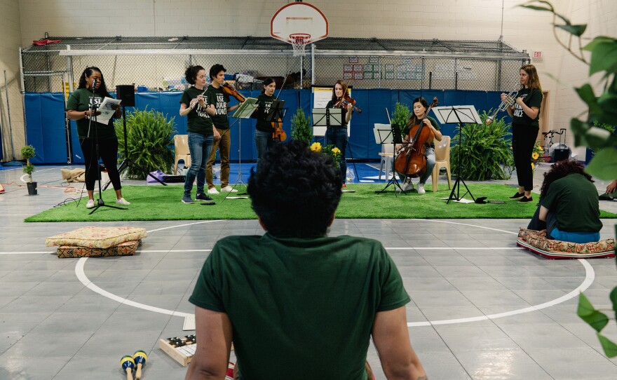 Residents listen as <a href="https://www.soundimpact.org/">Sound Impact</a> musicians play during the final performance of their three-day residency at the Northern Virginia Juvenile Detention Center in Alexandria, Va.