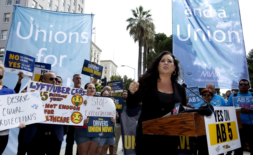 Assemblywoman Lorena Gonzalez, D-San Diego, speaks at an August 28 rally in Sacramento, Calif., calling for passage of AB5 to limit when companies can label workers as independent contractors.