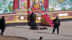 This photo, provided to <a href="http://freetibet.org/">freetibet.org</a>, shows a man being forcibly detained by security forces in the town of Serther in Tibet following a clash with protesters and police.