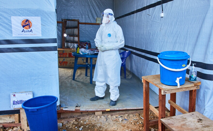 A health worker stands at the Evangelical Medical Center, in Bunia, eastern Congo, Friday, July 3, 2026, where Ebola clinical trials are scheduled to take place.