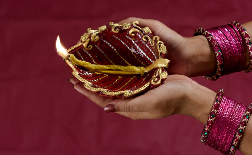 Millions of Indians light earthen lamps for the Diwali festival. Designs range from simple to fancy.