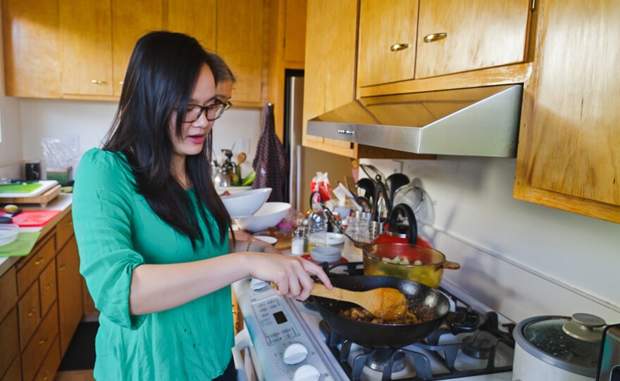 Khanh-Hoa Nguyen cooks caramelized pork belly with ginger, a Cambodian dish served to women who have just given birth.