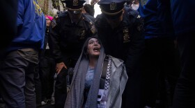 Police detain Nerdeen Kiswani, an organizer of pro-Palestinian demonstration group "Within Our Lifetime" during a protest on Friday, April 12, 2024, in New York.