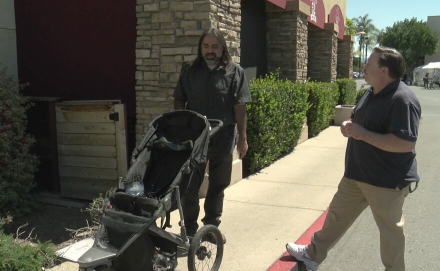 KPBS reporter John Carroll speaks with Miguel Rodriguez in Santee, Calif. on April 30, 2021.