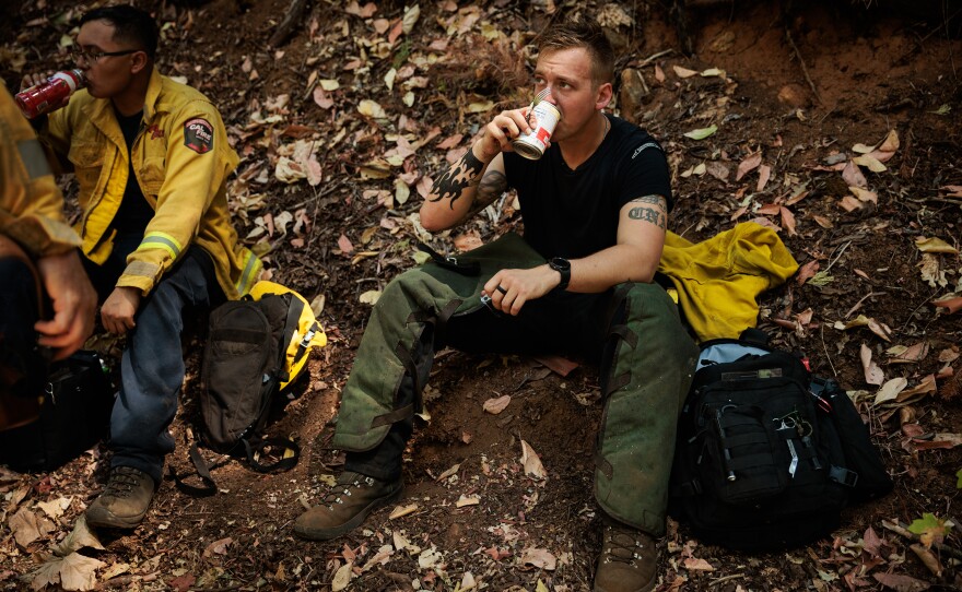 California National Guard Sgt. Tyler Bingham pauses for lunch while brush clearing with Task Force Rattlesnake.